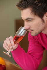 Man smelling wine