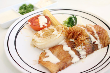 Grilled fish and vegetable with seasoning source