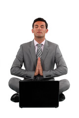 Calm businessman sat in yoga