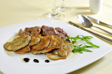 Lamb medallions with homemade potato pancakes, Czech cuisine