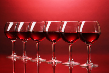 Wineglasses on red background