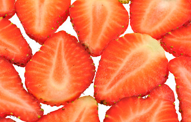 close up of strawberri slices arranged on white