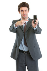 Naklejka premium Modern businessman pointing on cell phone