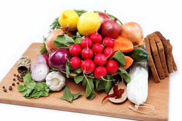 Healthy food. Fresh vegetables and fruits on a wooden board.