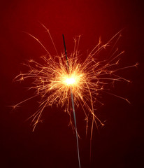 beautiful sparkler on red background