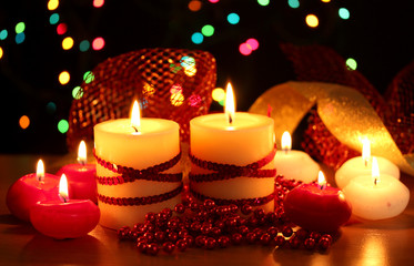 Beautiful candles and decor on wooden table on bright background