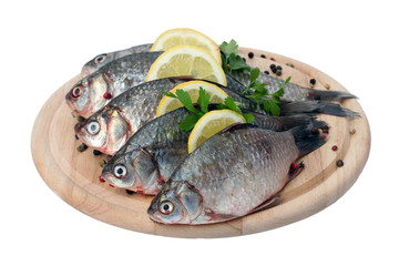 Fresh fishes with lemon, parsley and spice