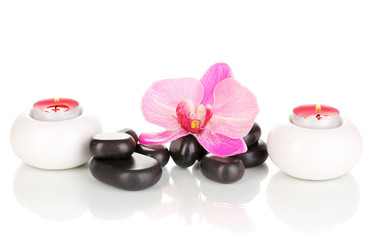 Fototapeta na wymiar Spa stones with orchid flower and candles isolated on white