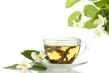 cup of green tea with jasmine flowers isolated on white
