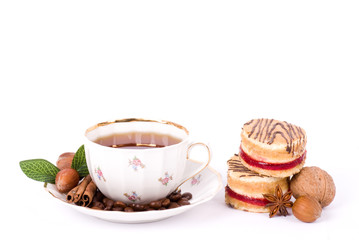 Beautiful tea set with cupcakes on white background