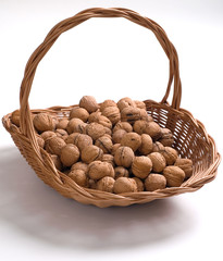 walnuts in a basket - obrazy, fototapety, plakaty