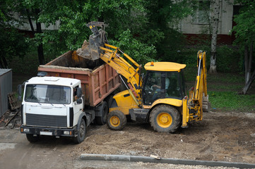 Tractor. Cleaning the yard