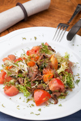 Tofu marinated in soy sauce with tomato and salad