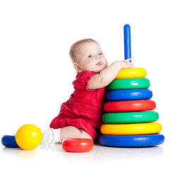 baby girl playing with big toy isolated on white background