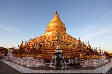 Shwezigon pagoda in Bagan, Myanmar, sunlit at sunset - 41678268