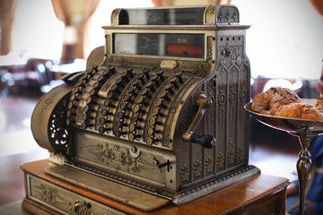 Antique cash register in a coffee shop - 41679263