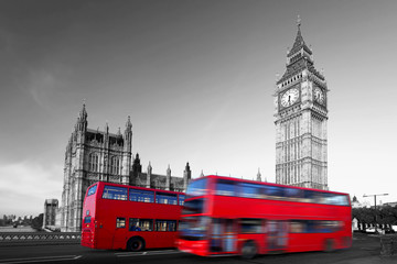 Big Ben with red city buses in London, UK