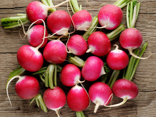 Radishes on wooden background
