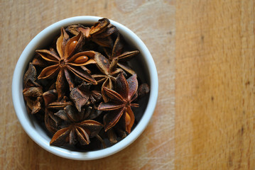 star anise in a white bowl