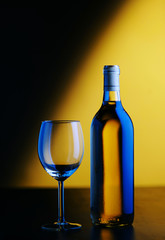 Bottle and glass of white wine