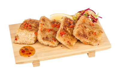 Fried fish fillets with  salad.