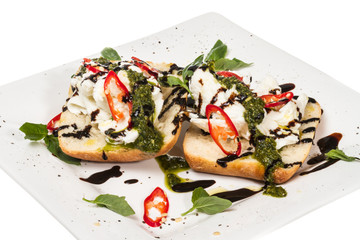 Fresh toast sandwiches with cheese and basilic and pesto.
