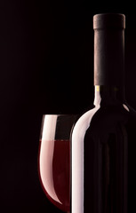 Still-life with bottle and footed glass