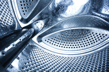 washing machine drum whith water drips