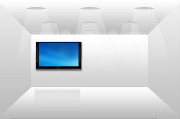 Open space with a plasma tv on the wall reflected on the floor