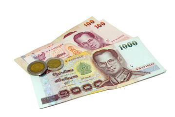 Obraz na płótnie Canvas Thailand paper currency and coins isolated over white