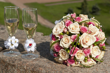 Wedding Bouquet Beside Tall Wine Glasses