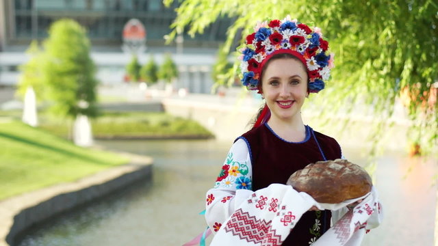 Girl with a loaf. Welcome to Ukraine. Euro-2012.