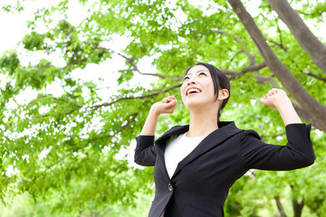 asian businesswoman relaxing in the park