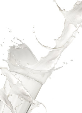Pouring milk into glass, isolated on white background