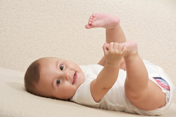 Happy baby gambling with here feet's