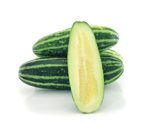 Cucumber and slices isolated over white background.