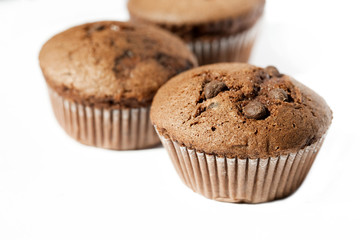 Chocolate muffins on the white background