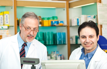 Portrait of two pharmacists in a store