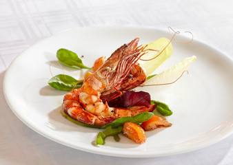 fried prawns on white plate on white tablecloth