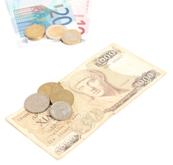 greek drachma with coins and euro banknotes with coins