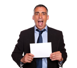 Attractive man holding a white card with copyspace