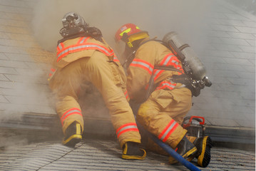 working an active attic fire in a dwelling on fire