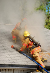 enlarging the vent hole on a dwelling on fire