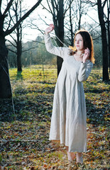 Young beautiful woman in long dress
