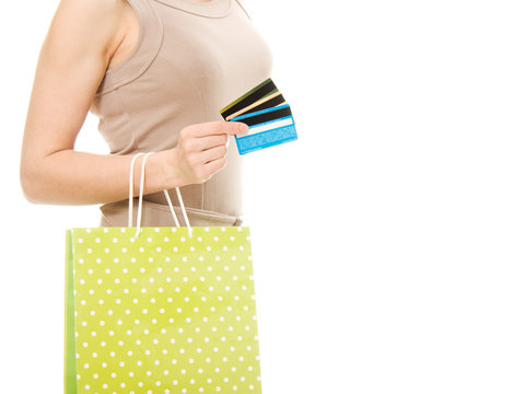 Woman with credit cards and shopping.