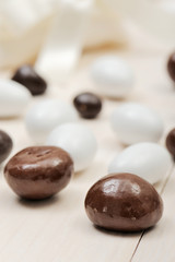 closeup of sugared chocolate, on wooden table