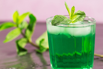 iced mint glass over pink background