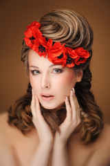 Naklejka premium Beautiful woman in bright red poppy wreath, closeup