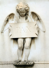 angelic figure holding plate with inscription pax ( peace )