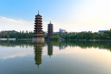 Fotobehang twin pagodas in banyan lake © chungking